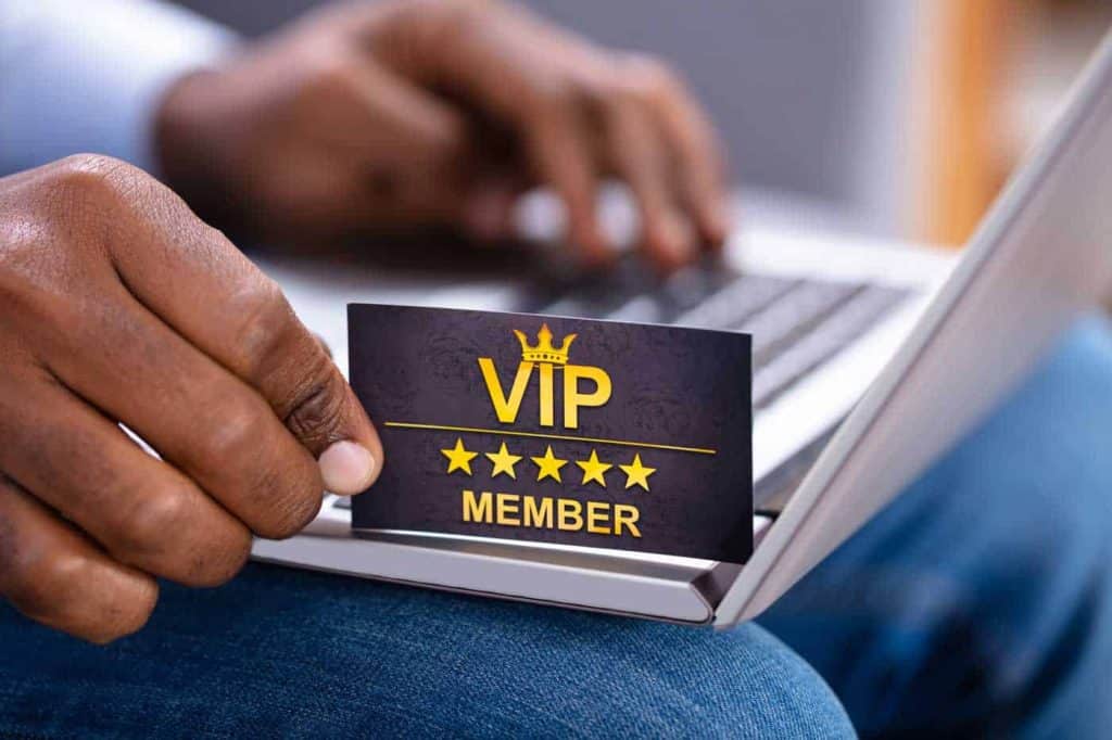 person holding a VIP card as loyalty marketing offer